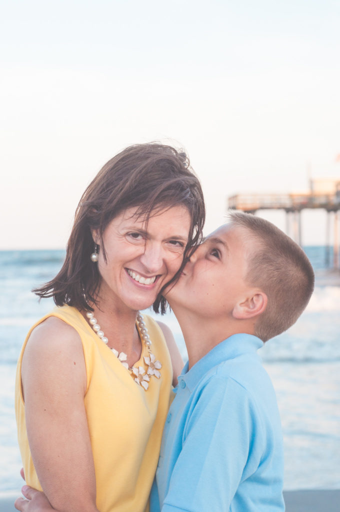 mother gets kiss from son